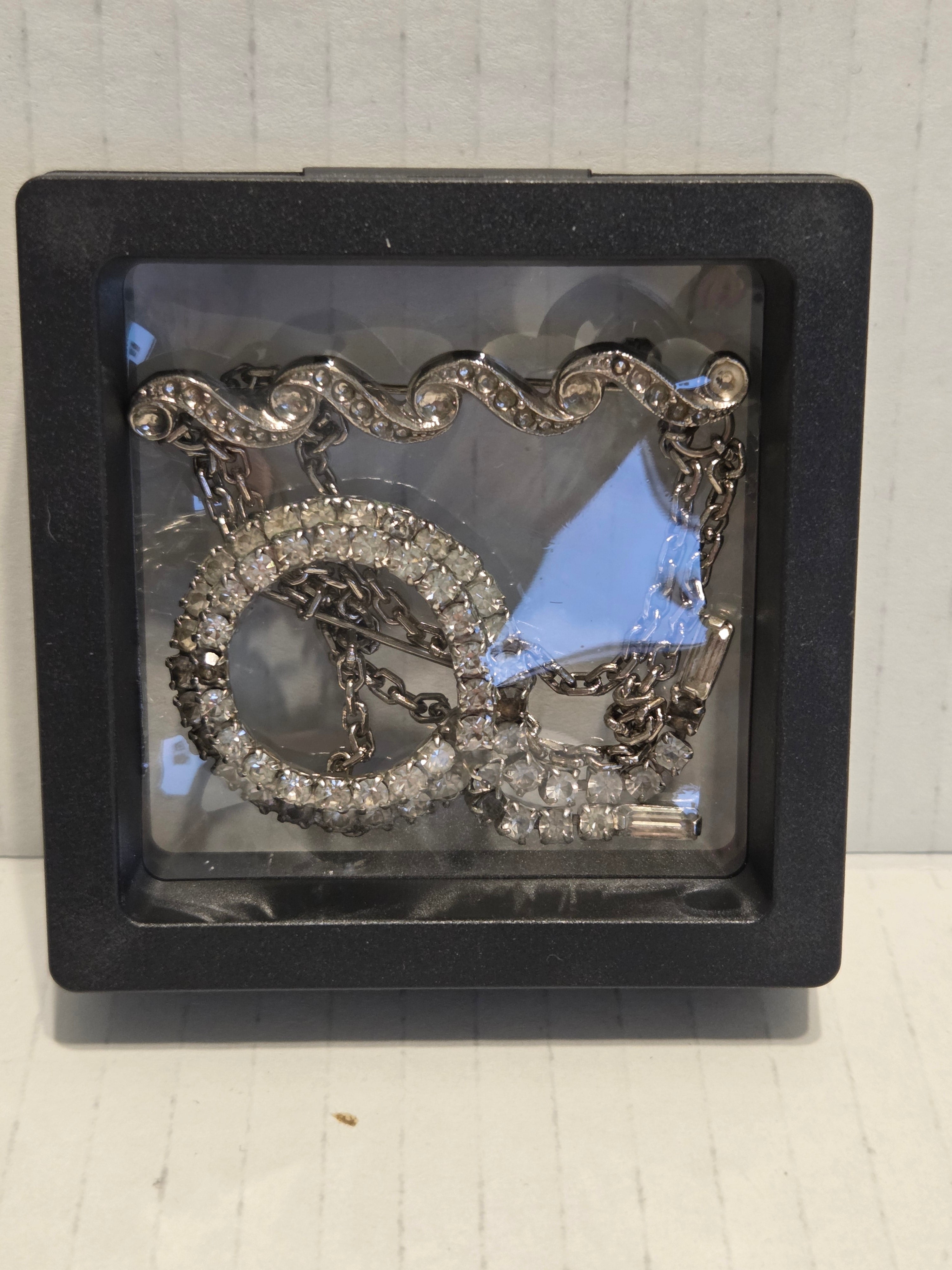 Rhinestone broaches very old
